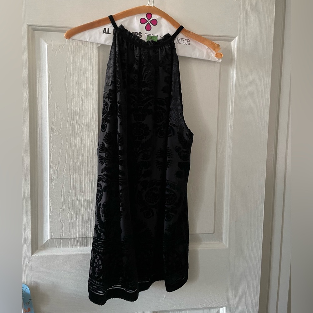 Black top with embossed flowers and leaves